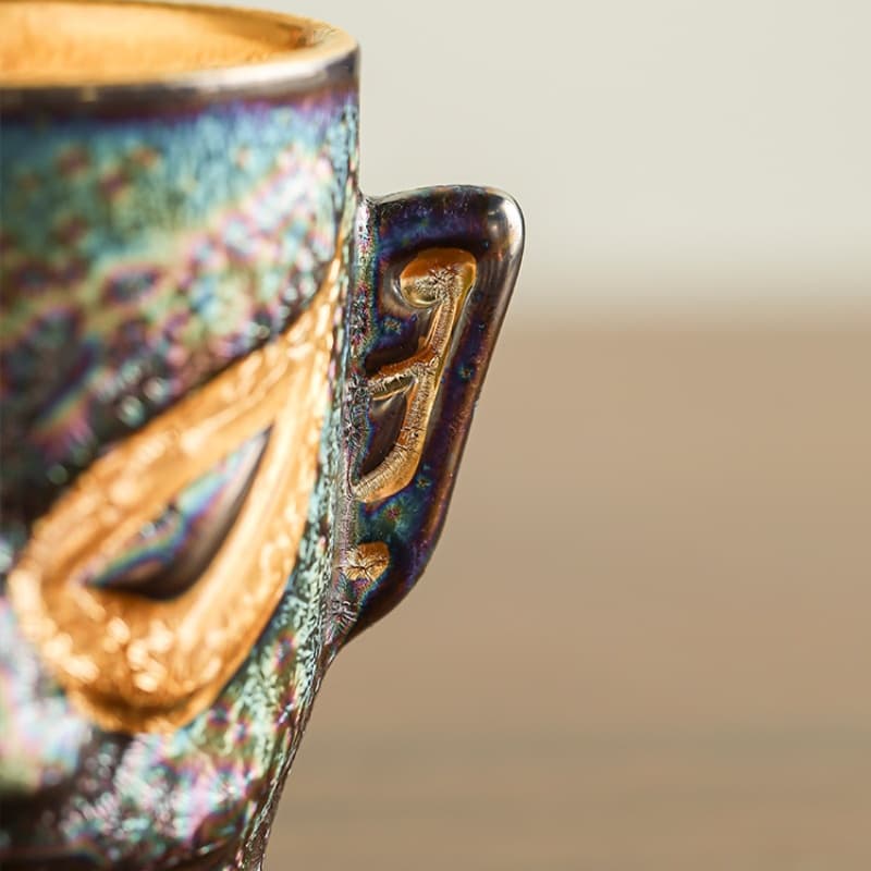 【Tea cup】Gilded teacup with the style of Sanxingdui masks