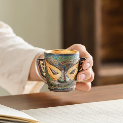 【Tea cup】Gilded teacup with the style of Sanxingdui masks